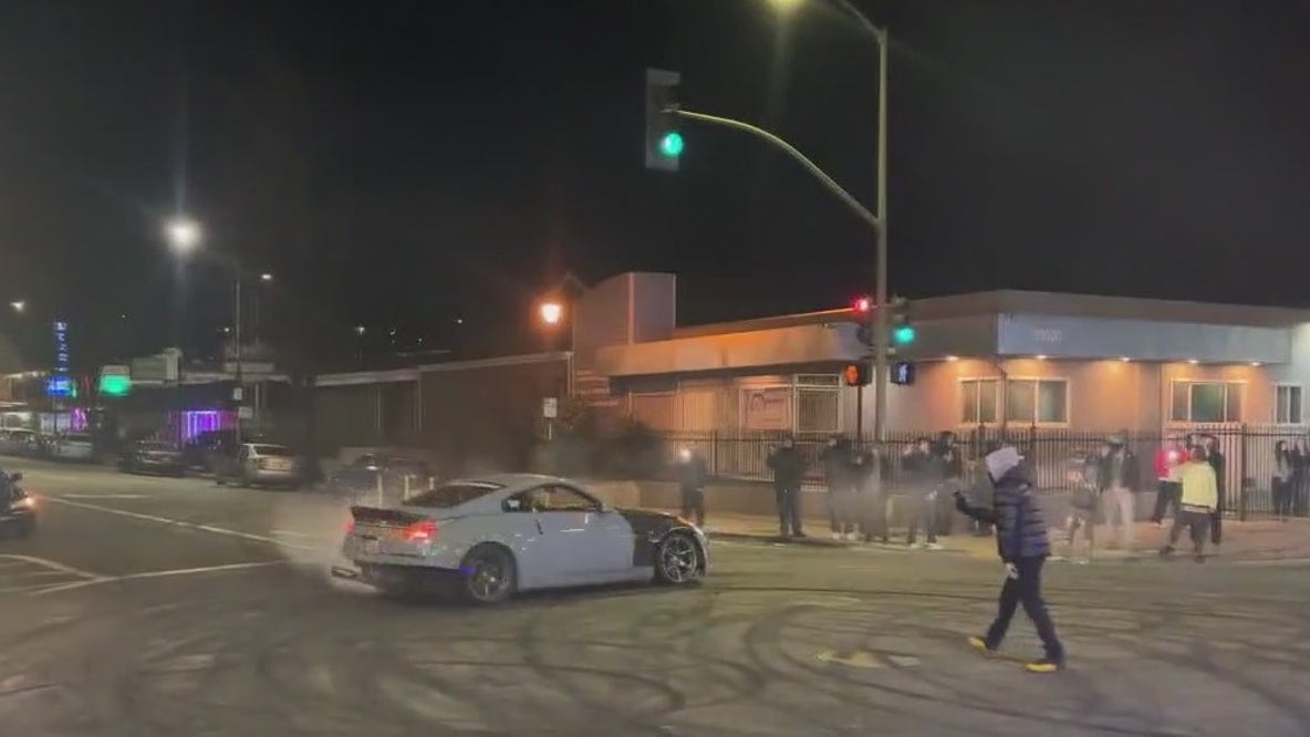 Cars spin at Oakland sideshow